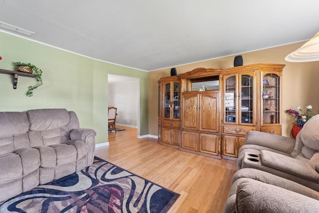 6411 W 88th St, Oak Lawn, IL 60453 - living room featuring light wood-style floors and ornamental molding