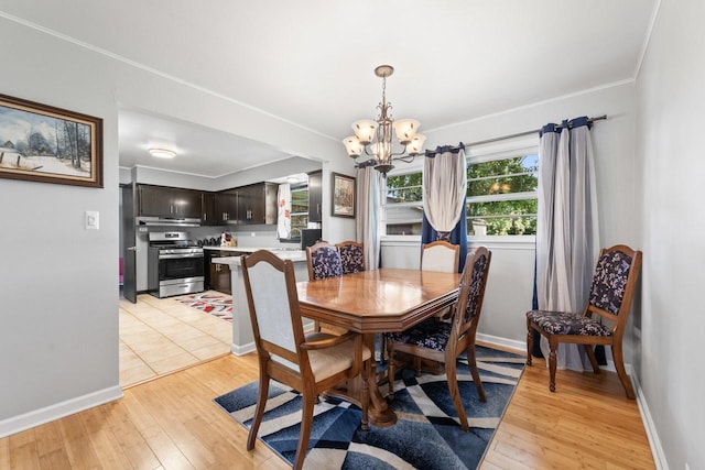 6411 W 88th St, Oak Lawn, IL 60453 - dining space with a chandelier, light wood finished floors, and crown molding