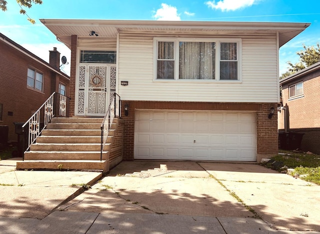 1629 E 92nd St, Chicago, IL 60617 - view of front of home featuring a garage, brick siding, and concrete driveway