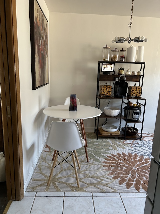 1629 E 92nd St, Chicago, IL 60617 - tiled dining room with baseboards and a chandelier