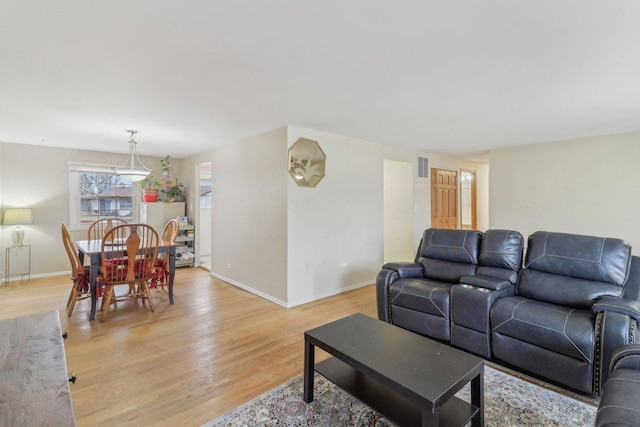 712 Dante Ct, Schaumburg, IL 60193 - living area with baseboards and light wood-style floors