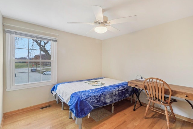712 Dante Ct, Schaumburg, IL 60193 - bedroom with light wood-style flooring and a ceiling fan