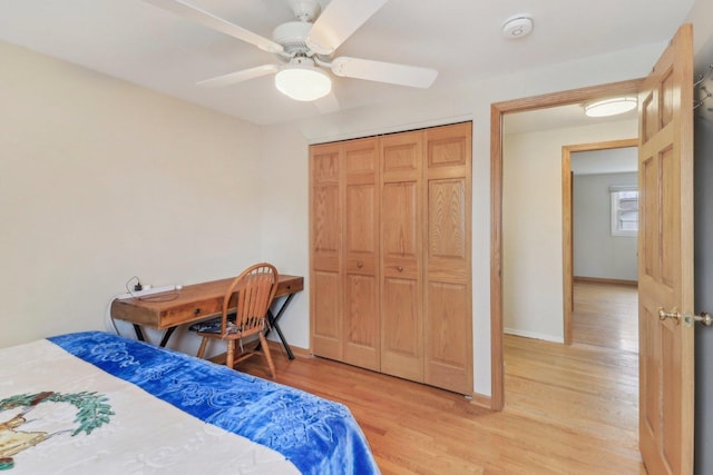 712 Dante Ct, Schaumburg, IL 60193 - bedroom with light wood-style flooring, a closet, and a ceiling fan