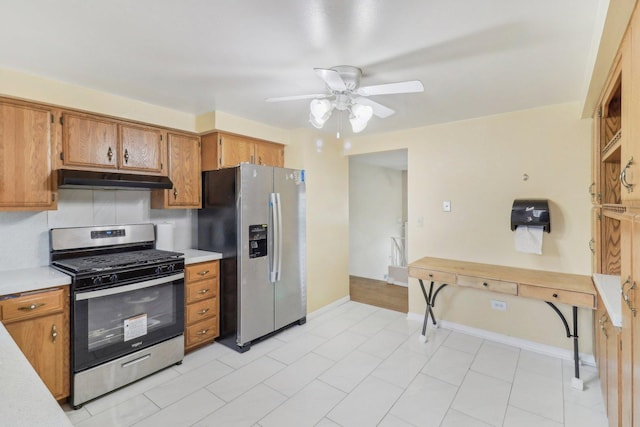 712 Dante Ct, Schaumburg, IL 60193 - kitchen with appliances with stainless steel finishes, under cabinet range hood, light countertops, and ceiling fan