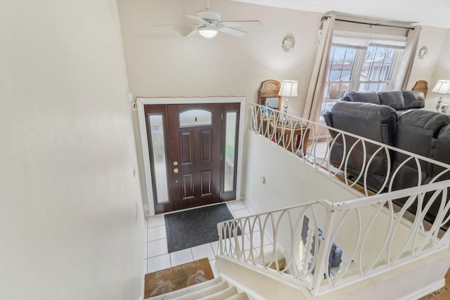 712 Dante Ct, Schaumburg, IL 60193 - tiled entryway featuring ceiling fan and stairs
