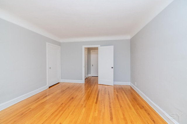6751 N Artesian Ave Unit 2C, Chicago, IL 60645 - spare room with light wood-style floors and baseboards