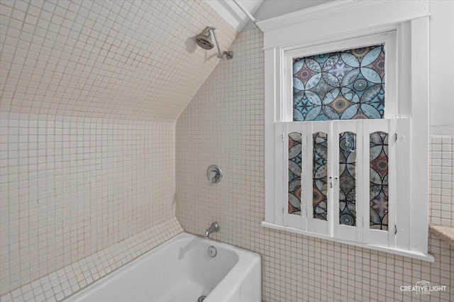 263 W Illinois Ave, Aurora, IL 60506 - full bathroom with lofted ceiling, tile walls, and tub / shower combination