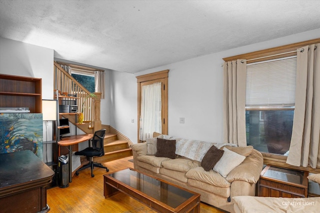263 W Illinois Ave, Aurora, IL 60506 - living area with stairs, a textured ceiling, and hardwood / wood-style flooring