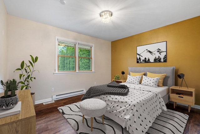 24935 S Ridge Rd, Elwood, IL 60421 - bedroom featuring baseboard heating, wood finished floors, and a chandelier