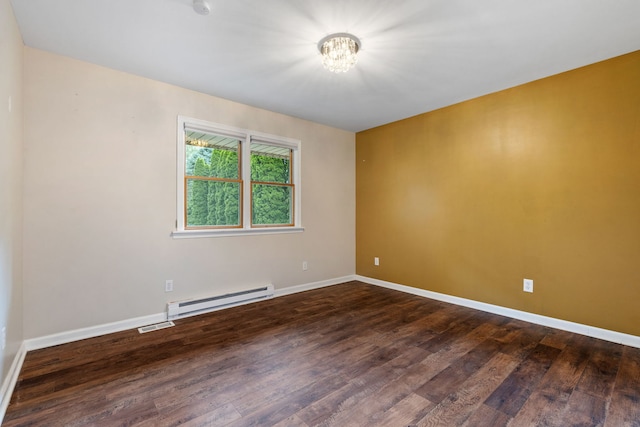 24935 S Ridge Rd, Elwood, IL 60421 - empty room with a baseboard heating unit, a chandelier, and wood finished floors