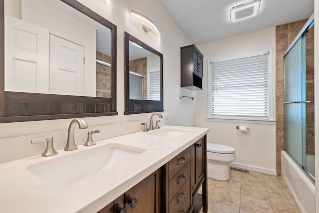 24935 S Ridge Rd, Elwood, IL 60421 - bathroom featuring double vanity, combined bath / shower with glass door, and tile patterned flooring
