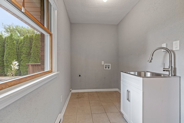 24935 S Ridge Rd, Elwood, IL 60421 - laundry area featuring cabinet space, light tile patterned flooring, hookup for a washing machine, a textured ceiling, and hookup for an electric dryer