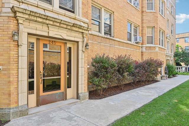 245 W Washington Blvd Unit 2B, Oak Park, IL 60302 - doorway to property with brick siding and cooling unit