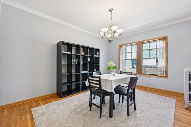 245 W Washington Blvd Unit 2B, Oak Park, IL 60302 - dining room featuring a chandelier, crown molding, and wood finished floors