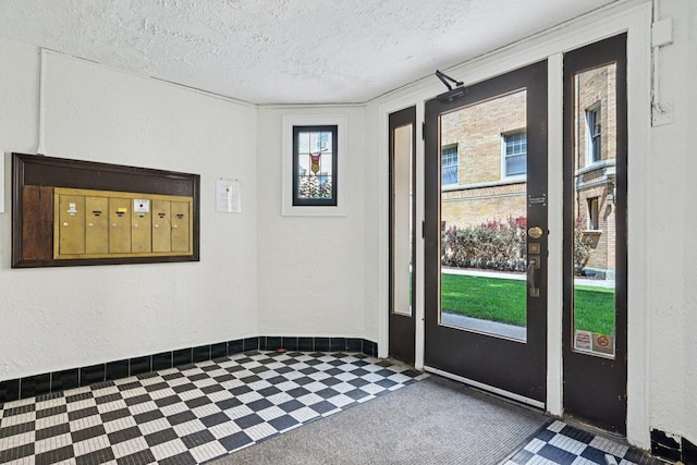 245 W Washington Blvd Unit 2B, Oak Park, IL 60302 - foyer entrance with a textured ceiling, a textured wall, and mail area