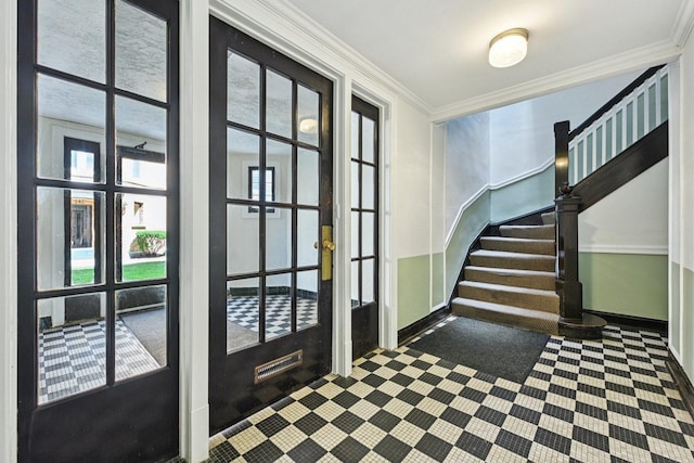 245 W Washington Blvd Unit 2B, Oak Park, IL 60302 - entrance foyer featuring crown molding, inlaid floor details, and stairway