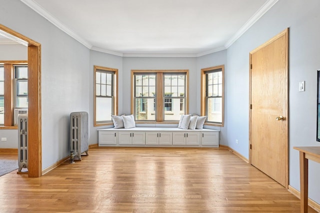 245 W Washington Blvd Unit 2B, Oak Park, IL 60302 - spare room featuring radiator heating unit, light wood-style flooring, and crown molding