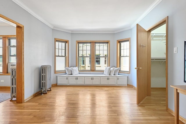 245 W Washington Blvd Unit 2B, Oak Park, IL 60302 - unfurnished room with radiator heating unit, light wood finished floors, and ornamental molding