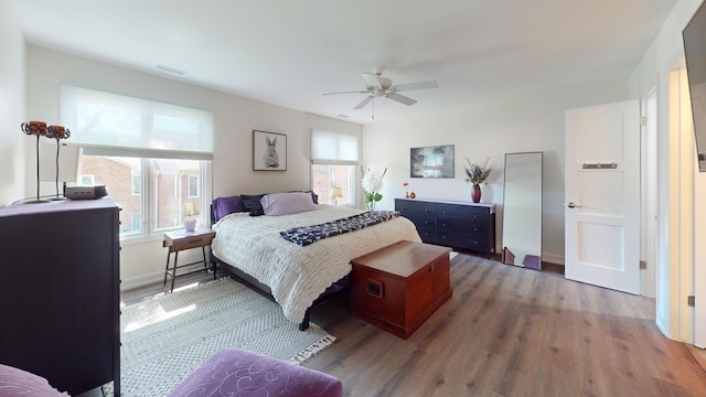 1671 N Belmont Ct, Arlington Heights, IL 60004 - bedroom featuring multiple windows, wood finished floors, and a ceiling fan
