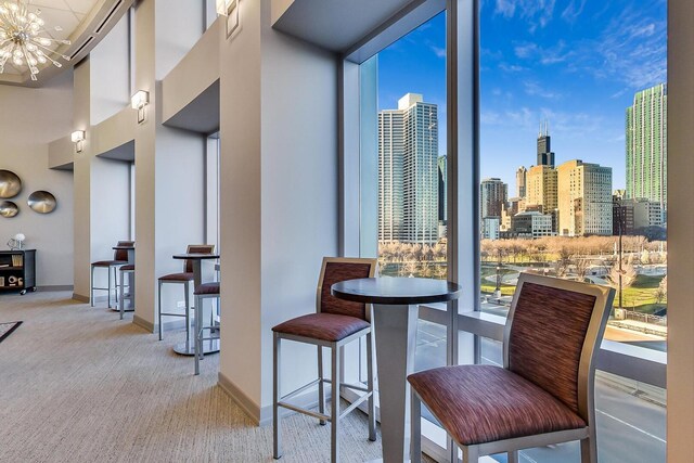 1211 S Prairie Ave Unit 1106, Chicago, IL 60605 - carpeted dining room featuring a chandelier and a skyline view