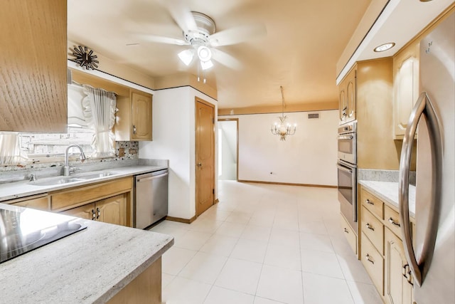 5215 S Meade Ave, Chicago, IL 60638 - kitchen with appliances with stainless steel finishes, light countertops, a ceiling fan, and a chandelier