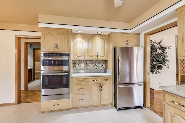 5215 S Meade Ave, Chicago, IL 60638 - kitchen with stainless steel appliances, backsplash, light brown cabinetry, and light stone counters