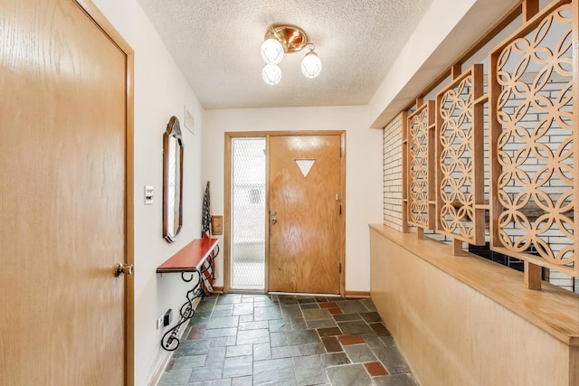5215 S Meade Ave, Chicago, IL 60638 - foyer entrance with stone tile flooring and a textured ceiling