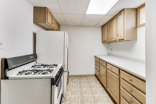 5215 S Meade Ave, Chicago, IL 60638 - kitchen featuring white range with gas stovetop, a paneled ceiling, and light countertops