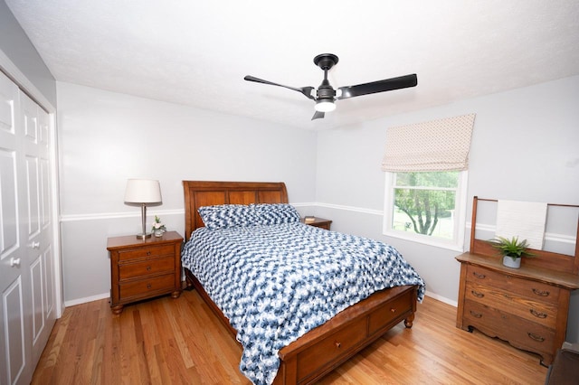 165 E Clay St, El Paso, IL 61738 - bedroom with light wood-style floors, a closet, and ceiling fan