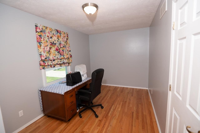 165 E Clay St, El Paso, IL 61738 - office featuring light wood-style floors and a textured ceiling