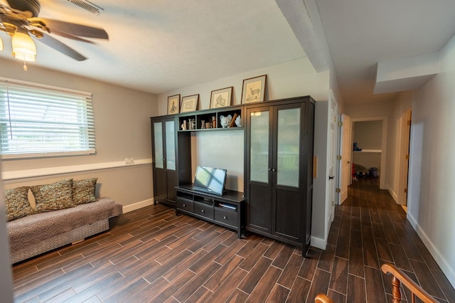 165 E Clay St, El Paso, IL 61738 - living room featuring dark wood-style flooring and ceiling fan