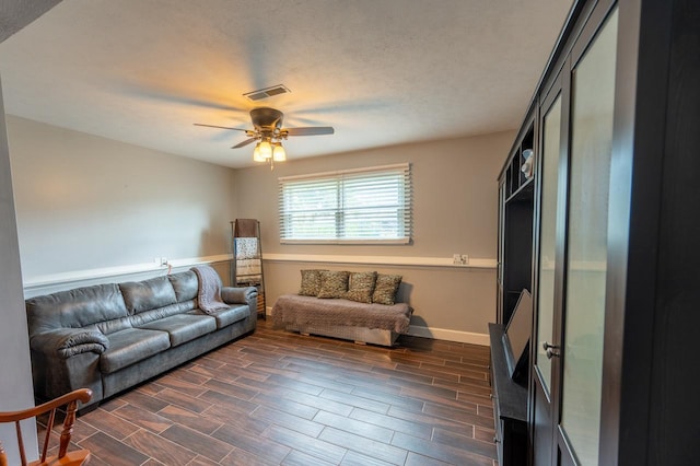 165 E Clay St, El Paso, IL 61738 - living room with ceiling fan and dark wood-style flooring