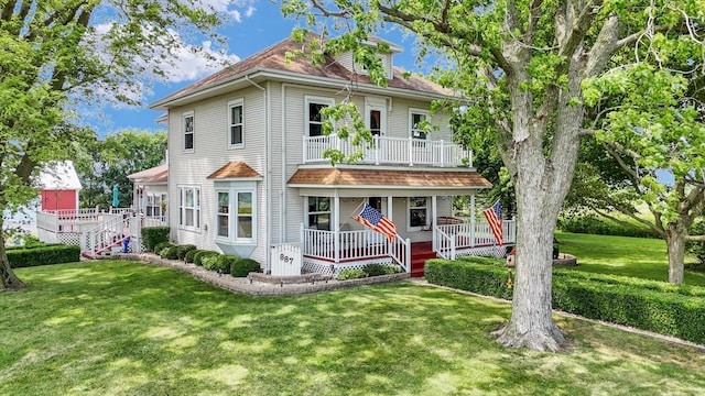 887 N 1100e Rd, Melvin, IL 60952 - traditional style home featuring covered porch, a balcony, and a front yard