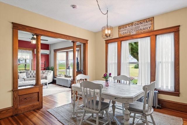 887 N 1100e Rd, Melvin, IL 60952 - dining area with wood finished floors, healthy amount of natural light, and ornate columns