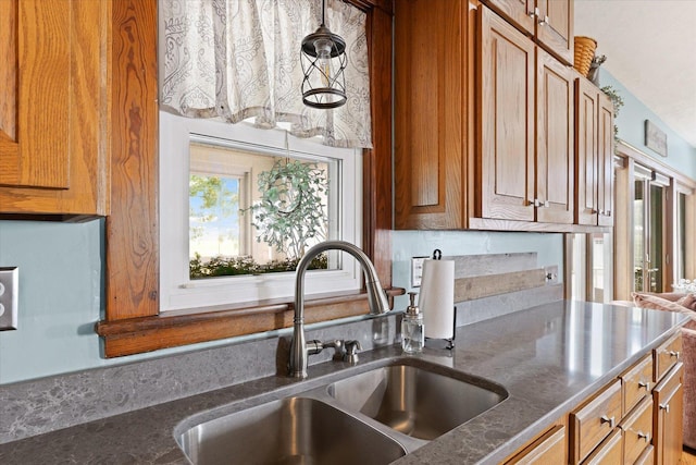 887 N 1100e Rd, Melvin, IL 60952 - kitchen with dark countertops and brown cabinetry