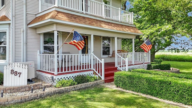 887 N 1100e Rd, Melvin, IL 60952 - property entrance featuring a porch and a balcony