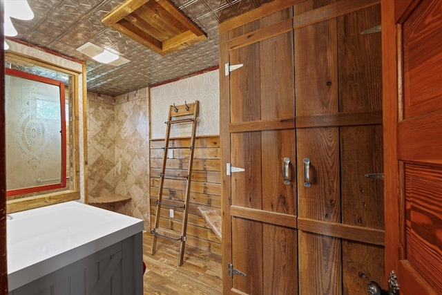 887 N 1100e Rd, Melvin, IL 60952 - bathroom featuring an ornate ceiling, vanity, wood finished floors, and wooden walls