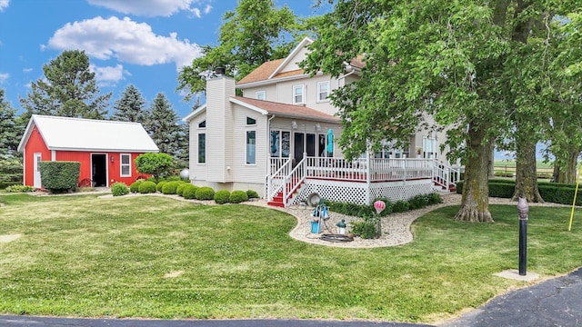 887 N 1100e Rd, Melvin, IL 60952 - view of front facade featuring a front yard, a chimney, an outbuilding, and a porch