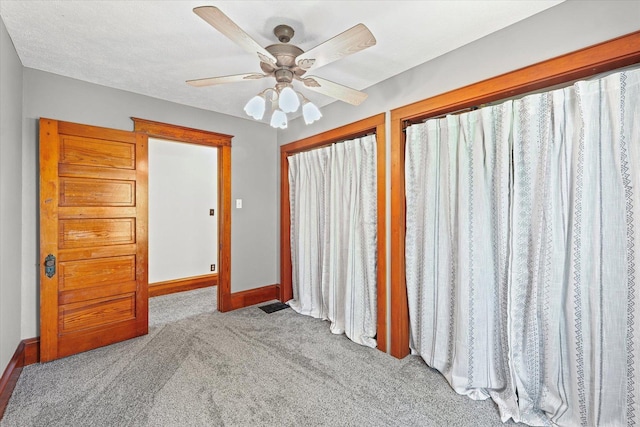 887 N 1100e Rd, Melvin, IL 60952 - carpeted empty room featuring baseboards and ceiling fan