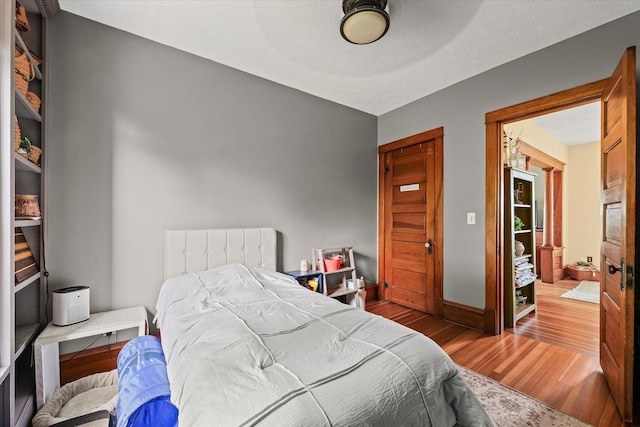 887 N 1100e Rd, Melvin, IL 60952 - bedroom featuring wood finished floors and baseboards