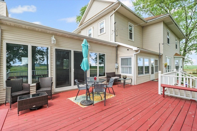 887 N 1100e Rd, Melvin, IL 60952 - deck featuring outdoor lounge area and outdoor dining area