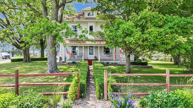 887 N 1100e Rd, Melvin, IL 60952 - american foursquare style home featuring a porch and a fenced front yard
