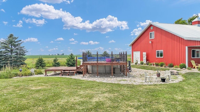 887 N 1100e Rd, Melvin, IL 60952 - view of green lawn with a deck and a pole building