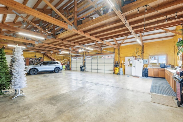 887 N 1100e Rd, Melvin, IL 60952 - garage featuring white fridge with ice dispenser