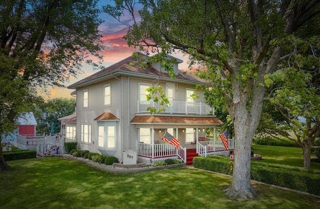 887 N 1100e Rd, Melvin, IL 60952 - american foursquare style home featuring covered porch, a lawn, and a balcony