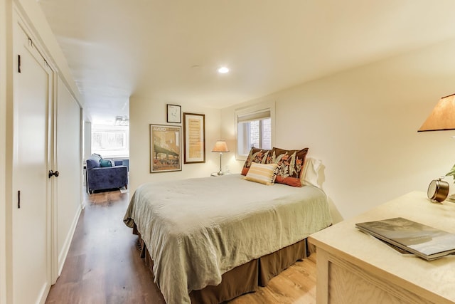 3740 N Whipple St, Chicago, IL 60618 - bedroom featuring light wood finished floors and recessed lighting