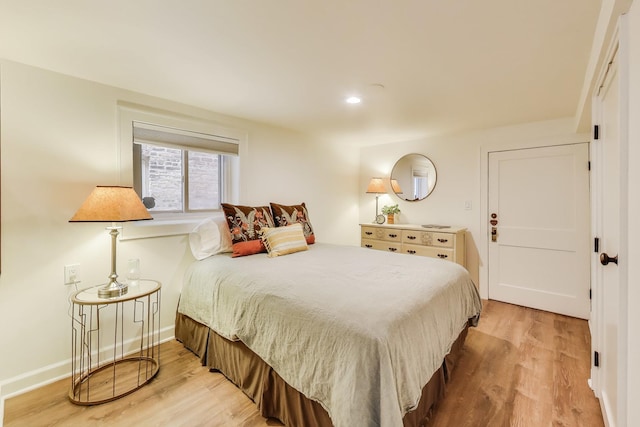 3740 N Whipple St, Chicago, IL 60618 - bedroom with light wood-style floors and recessed lighting