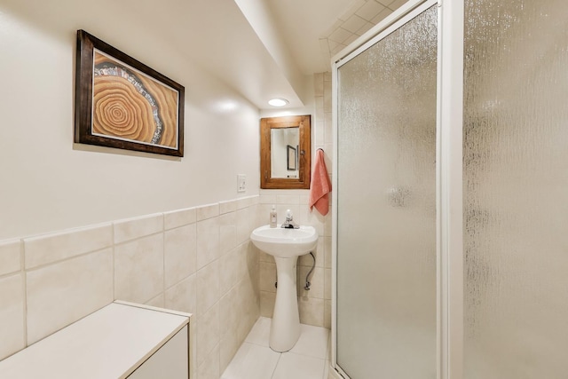 3740 N Whipple St, Chicago, IL 60618 - full bathroom with tile walls, a stall shower, and wainscoting