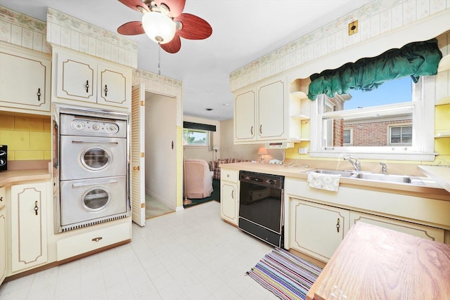 5504 Oakdale Dr, Oak Lawn, IL 60453 - kitchen with dishwasher, multiple ovens, light countertops, a ceiling fan, and wallpapered walls
