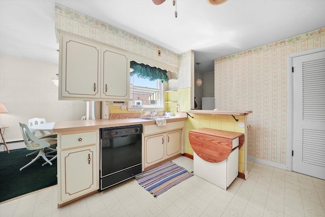 5504 Oakdale Dr, Oak Lawn, IL 60453 - kitchen with black dishwasher, a peninsula, wallpapered walls, light floors, and light countertops